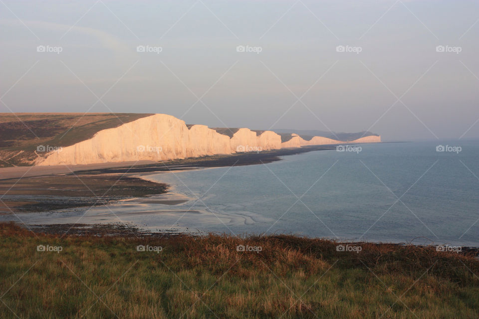 seven sisters. seaford. sussex. england beach white sunset by twickers