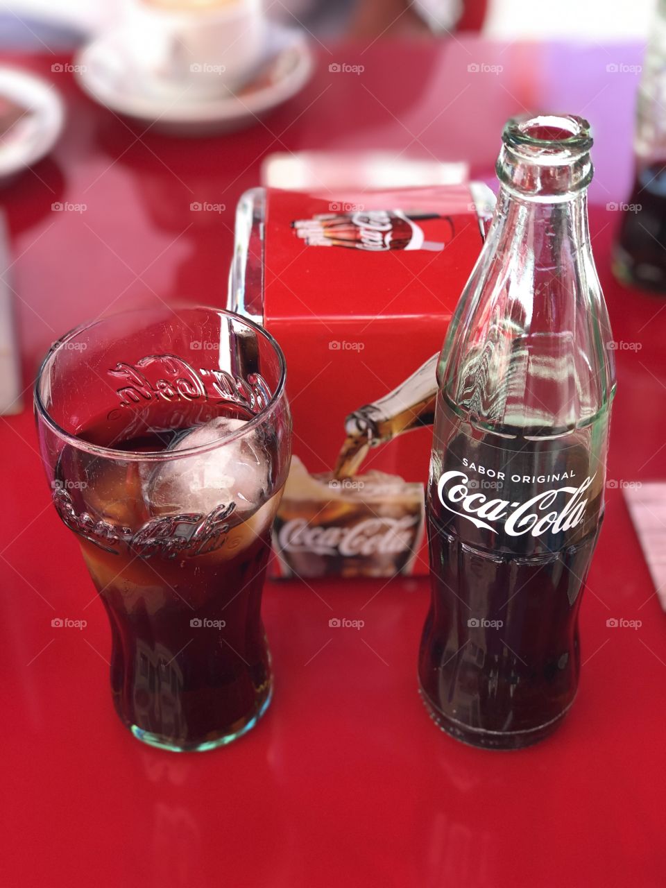 Refreshing ice cold Coca-Cola bottle and glass 
