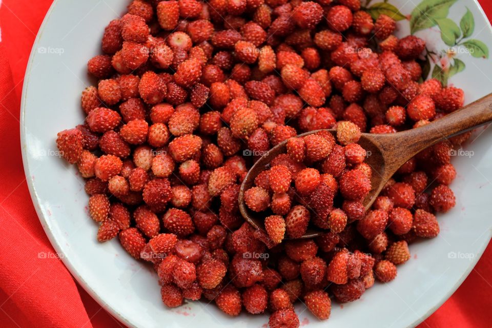 red strawberries on a plate tasty healthy summer food background