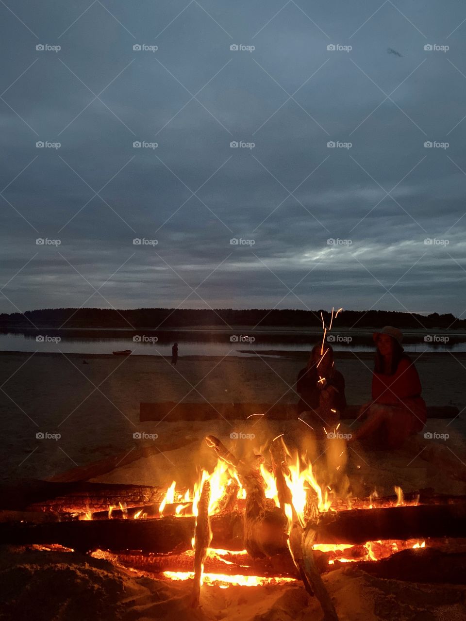 Heating near the bonfire at summer night