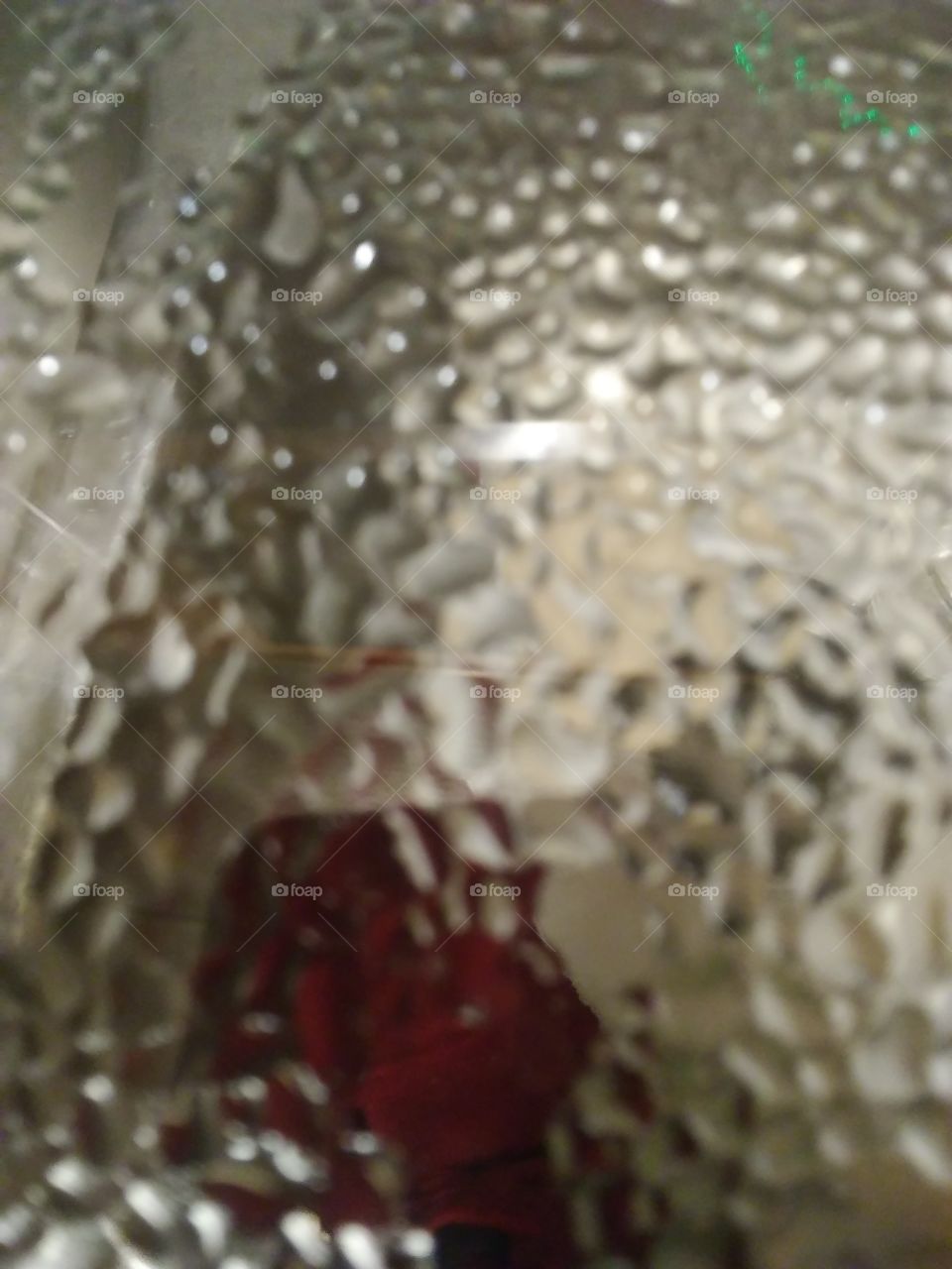 view of the sink through a glass lid