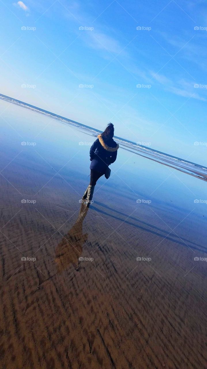 woman walking on beach