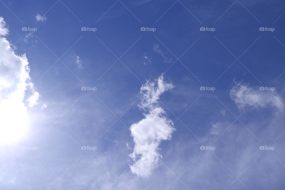 Photographs of the sky on a clear day without rain, clouds, and sunlight pouring in, giving a feeling of freshness and warmth. Suitable for use as a background image.