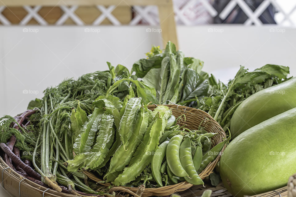 Vegetables in Thailand , Winged Bean , Peas and Winter melon in bamboo baskets.