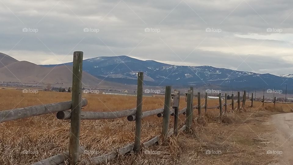 A wooden fence in the mountains