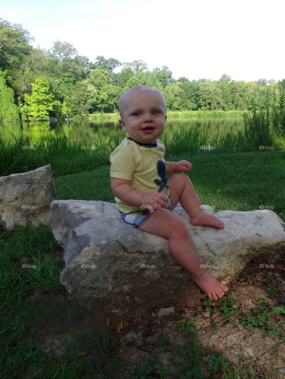 Baby by lake