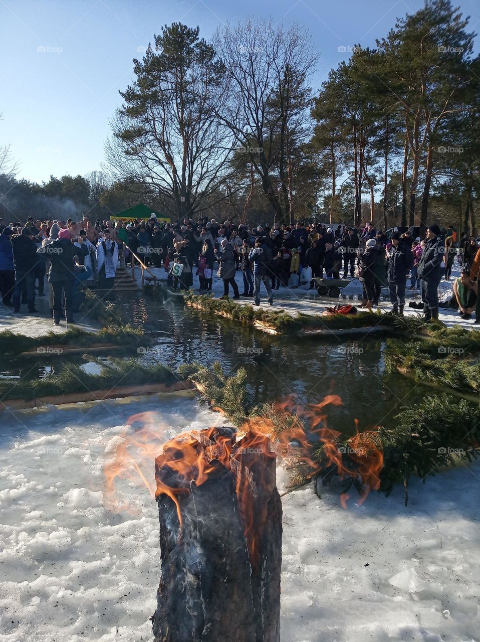Introducing the crowds revolution! baptism, many people at the feast of baptism, baptism on the lake, fire, cleansing, crowd around the lake with an ice hole