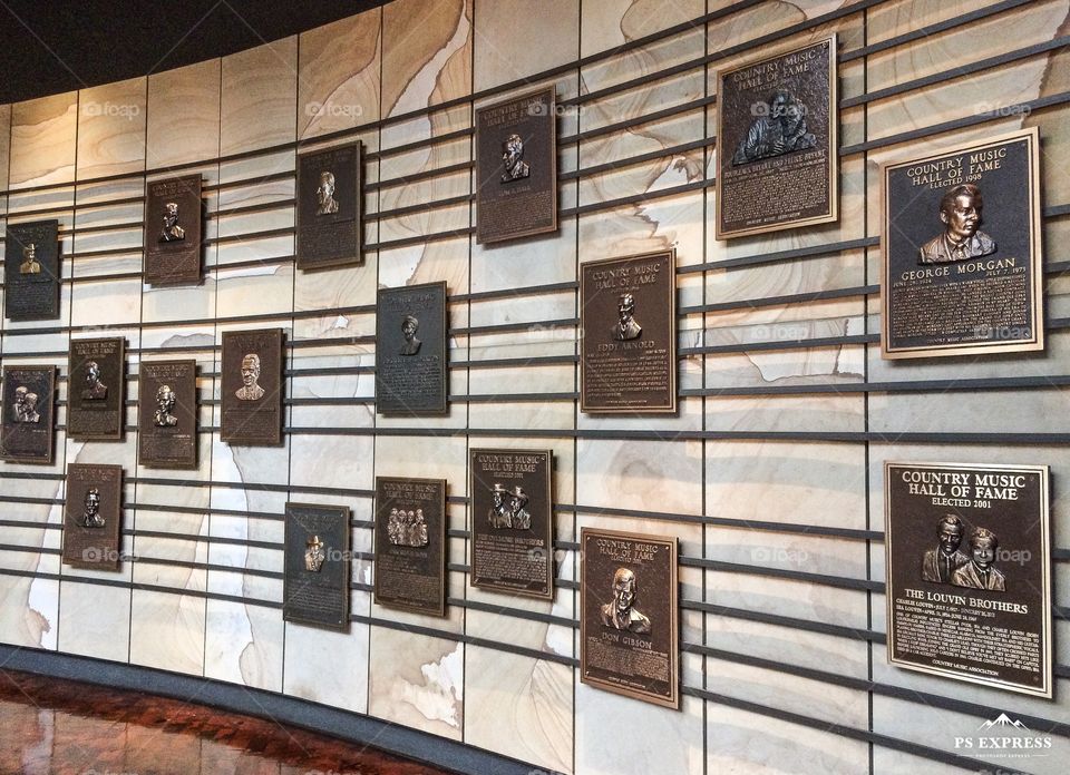 Country music hall of fame wall with many rectangular shapes