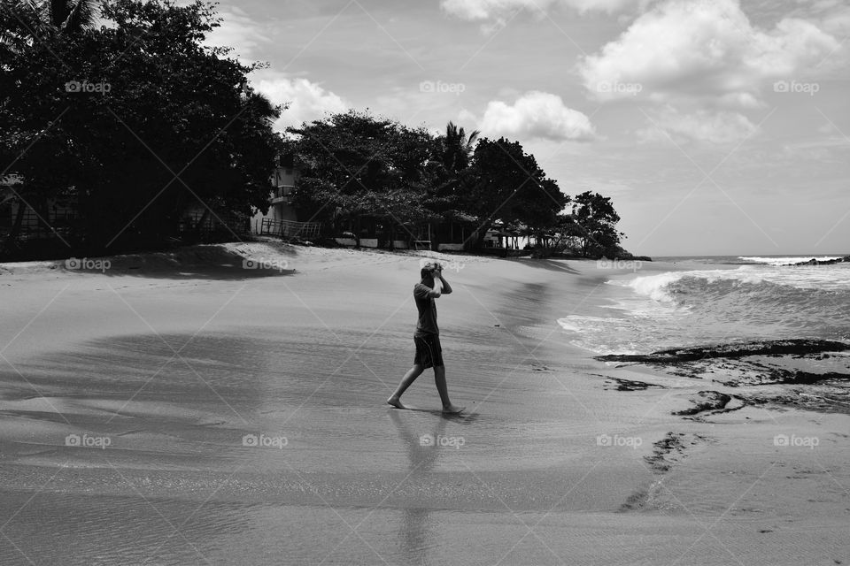 This is me. Walking on the south coast beach of Sri Lanka.