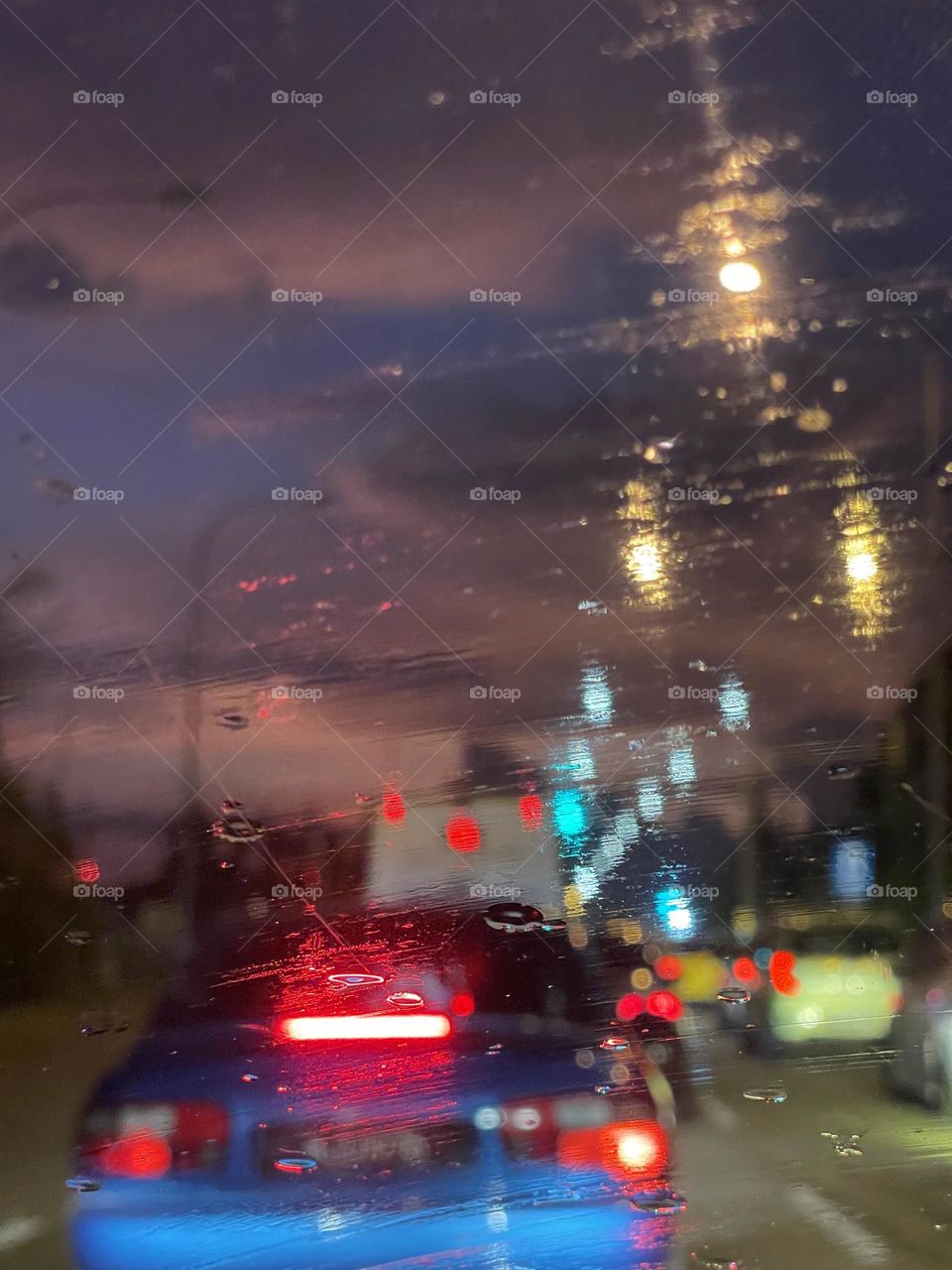 Long expose of a journey in a car in a rainy day at night