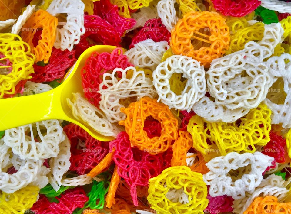 Geometric Series: Circle; pre-fried colourful crackers sold at market by weight