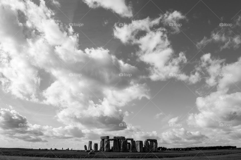 black and white stonehenge, with a cloudy sky