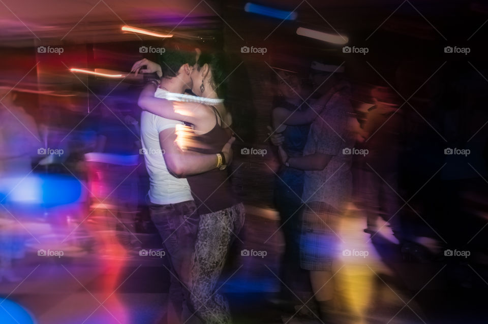 people dancing in the night club, photo with motion effect 