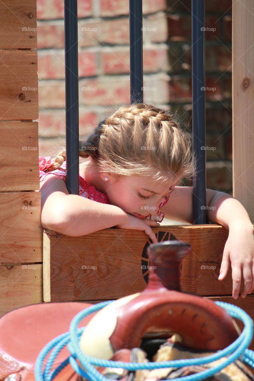 Reflecting. Girl reflecting on the cowgirl way of life