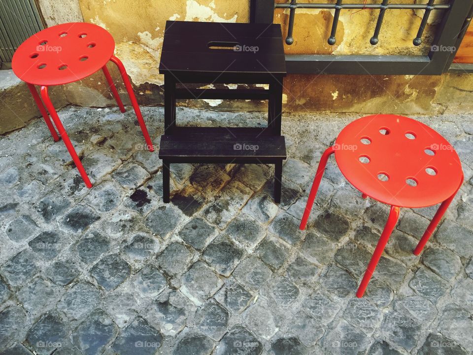 Seats in a cobblestone street