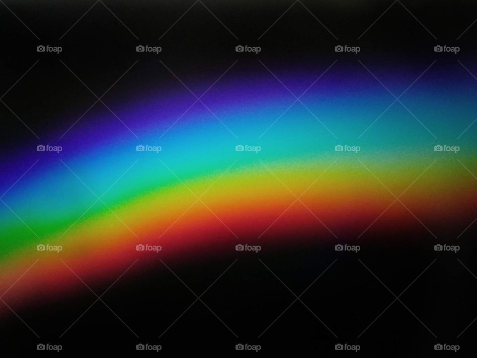 Photography of rainbow. Rainbow on black background.  Abstract web background. Banners and panels. Design background. Computer. Desktop background and design. Unique. Surrealistic. Dispersion of light