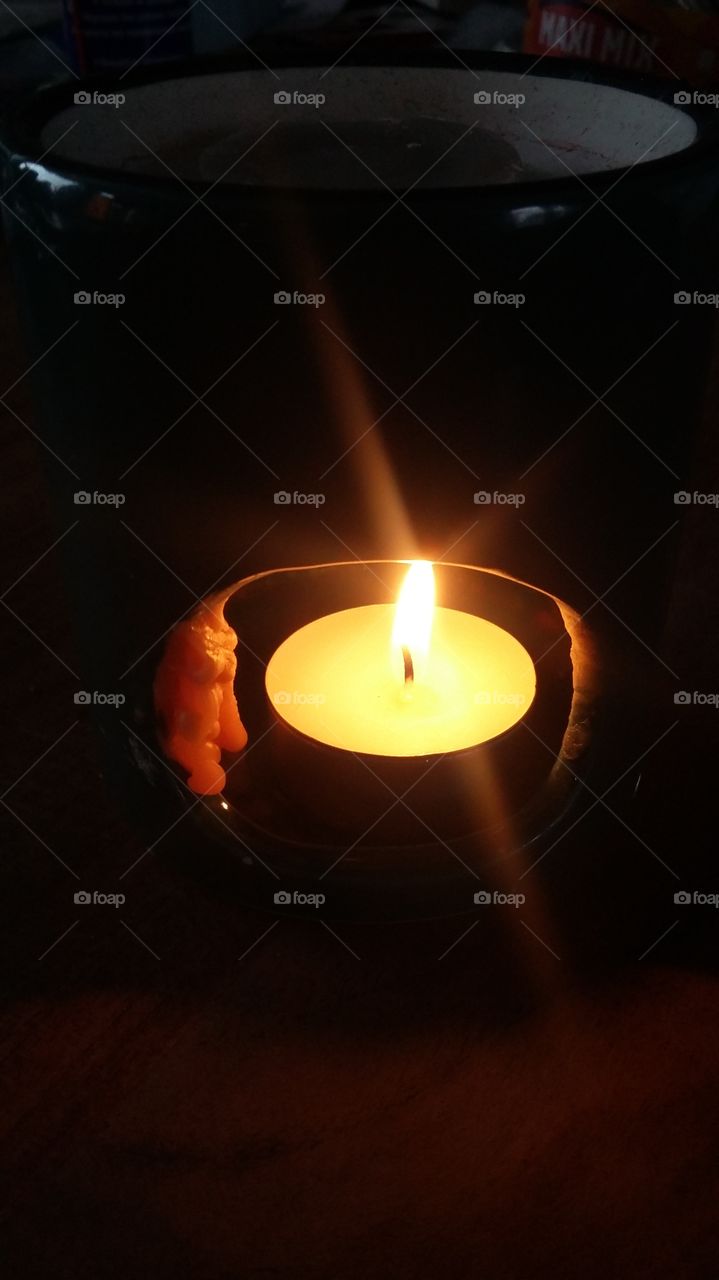 a burning candle with wax