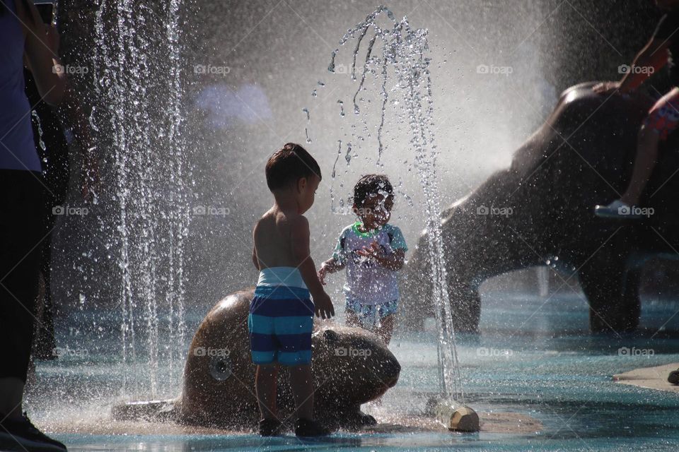 Toddlers are have great time at the splash pad