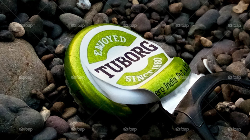 tuborg.... chills your life ... .. what is as good as a child beer on a beach.." tuborg..beers for life" beverage