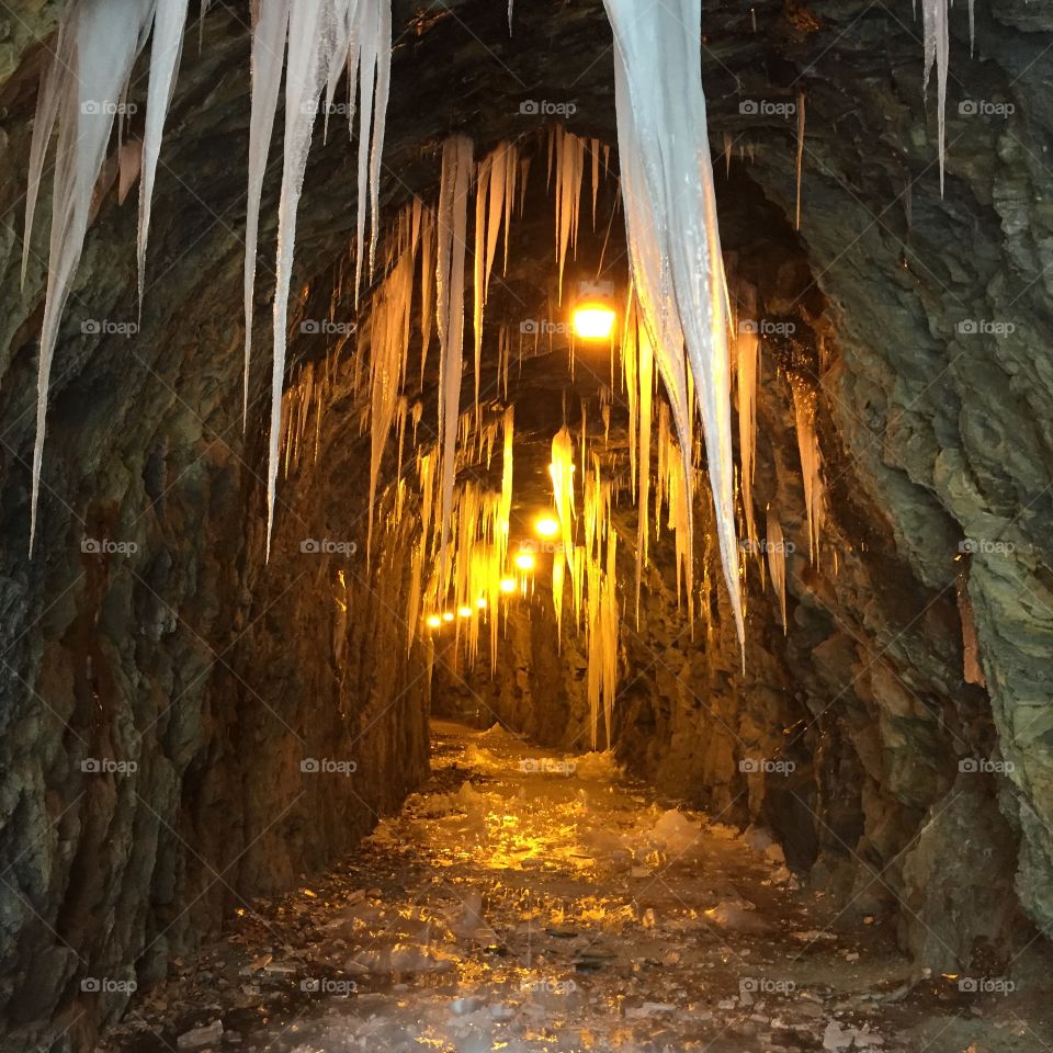 This cool tunnel is located on the BlackWater Creek Trail in Lynchburg, Virginia! The was taken when the ground water had froze during a cold spell in the winter. The tunnel was carved out of rock to allow trains to pass thru the small hill of rocks! The tracks were converted into a biking and running trail! 