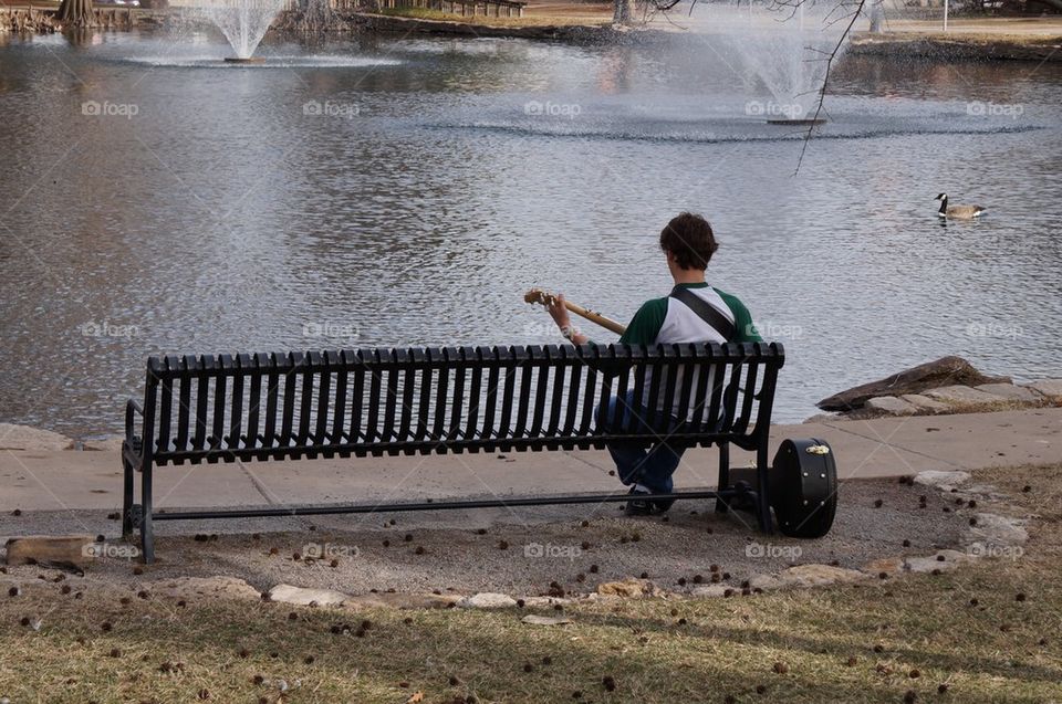 Playing banjo at the park