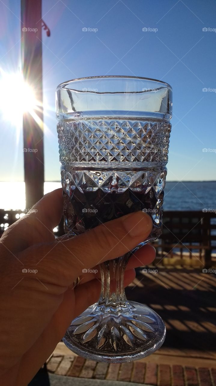 Sitting on the dock of the bay...watching the sun. go down on horizon.  Cheers!