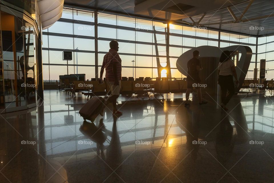 Airport departure gates at sunset