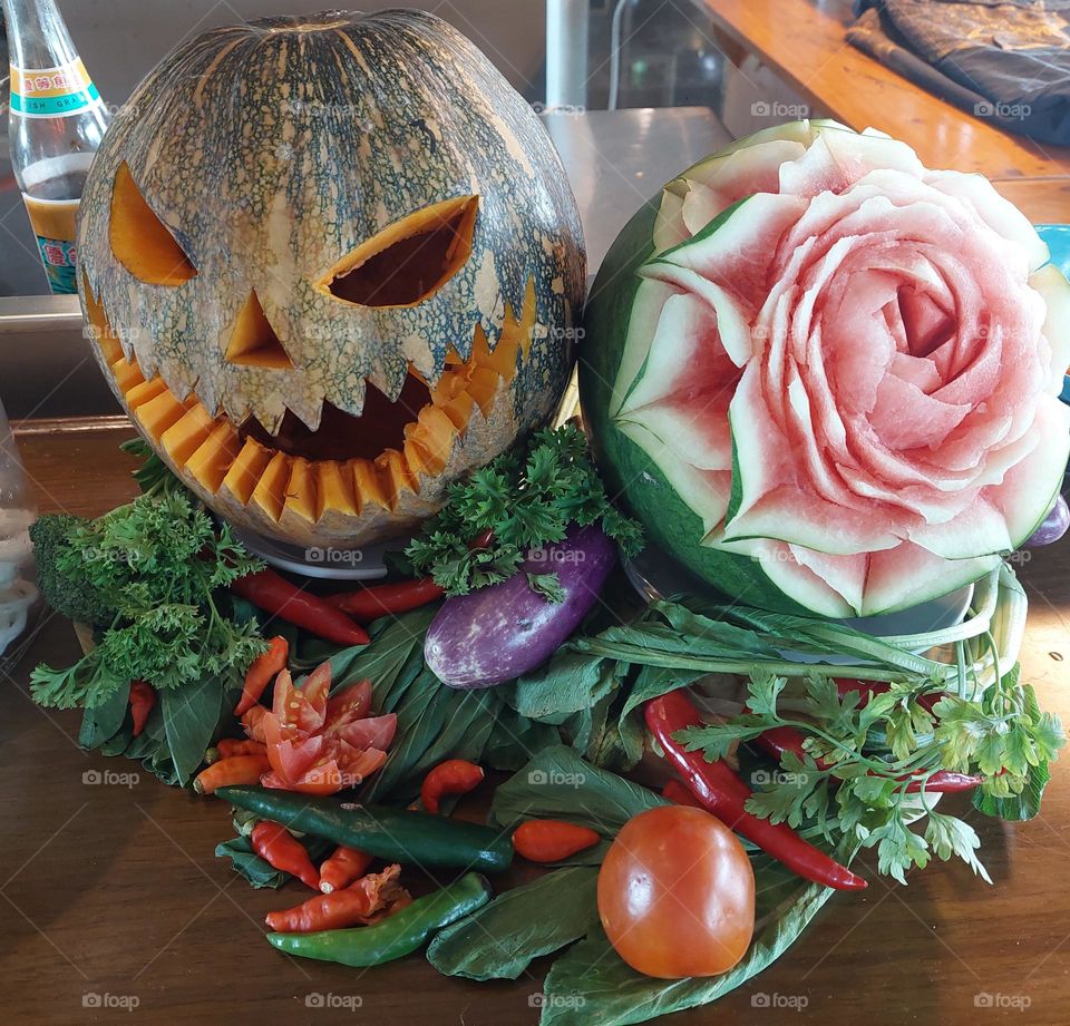 carved pumpkins for halloween parties and carved watermelons in the shape of roses