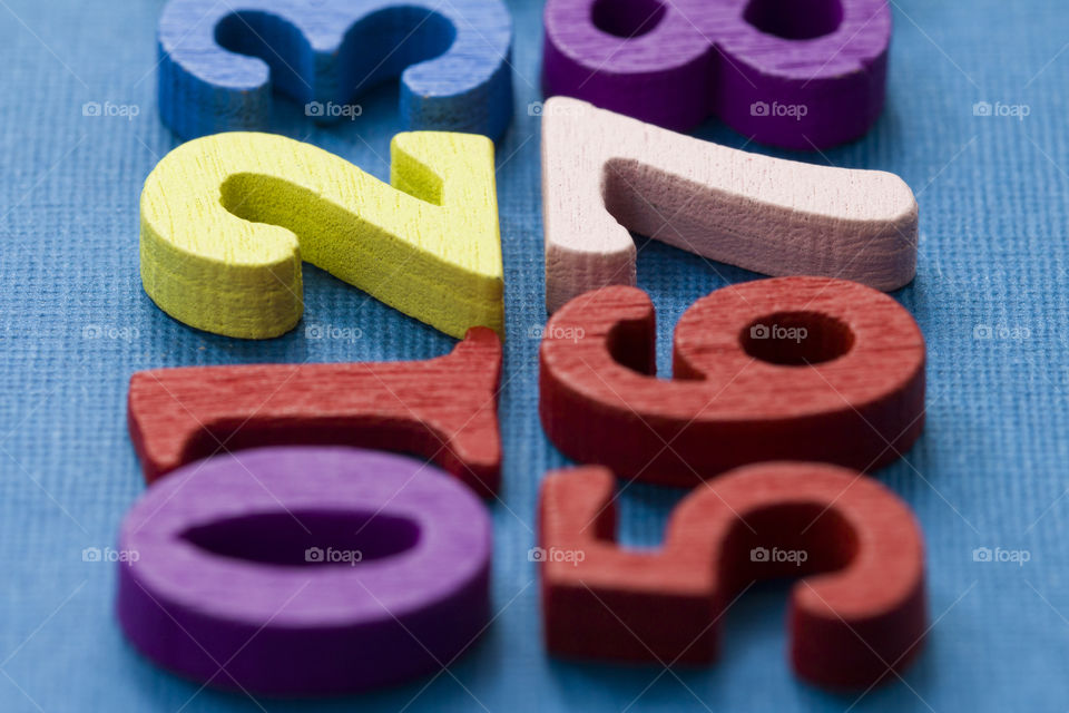 multicolored wooden numbers.  colorful mathematics concept
