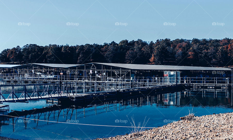 A lake marina with reflections in the water. 