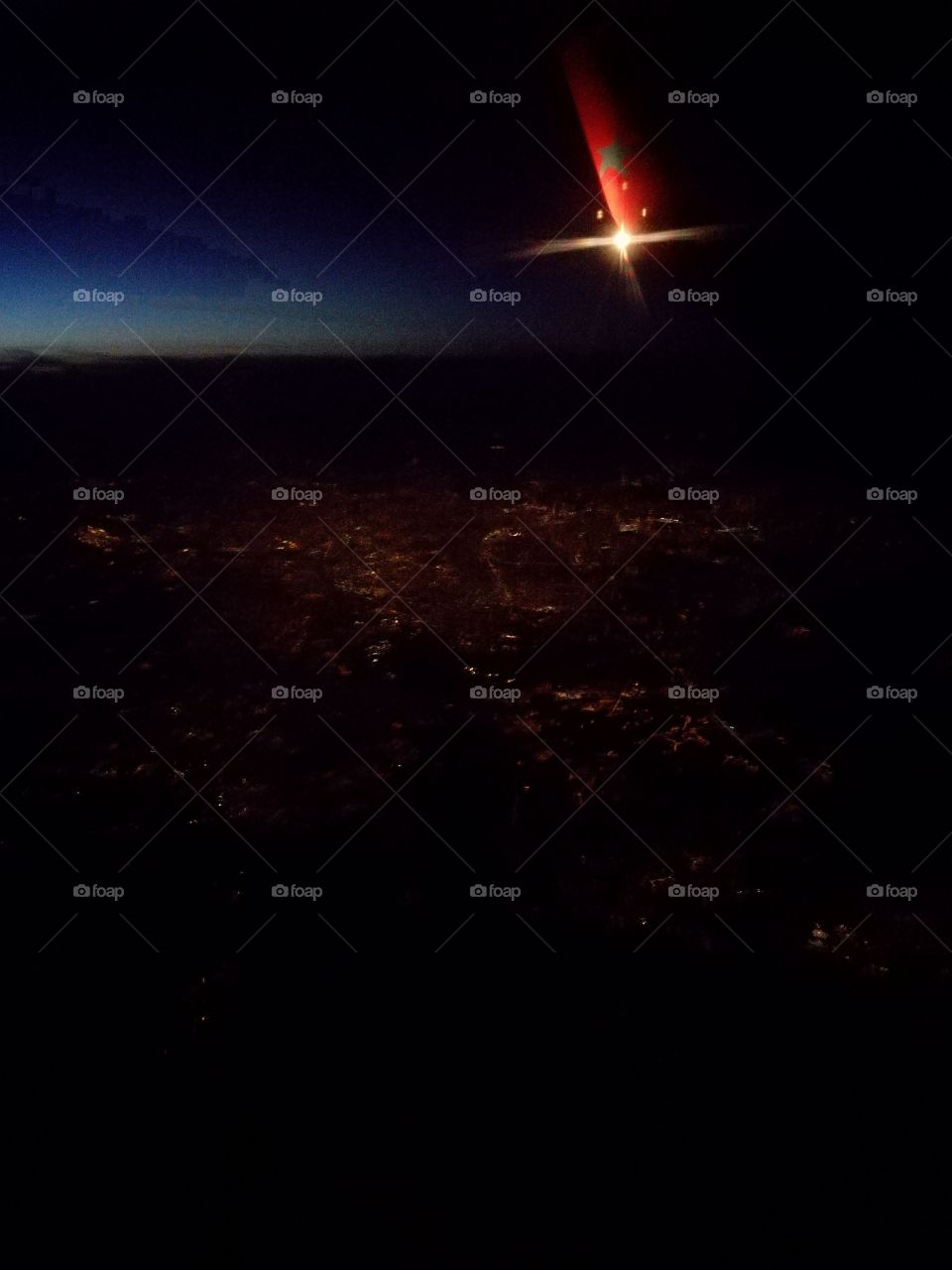 Paris at night flown over by plane