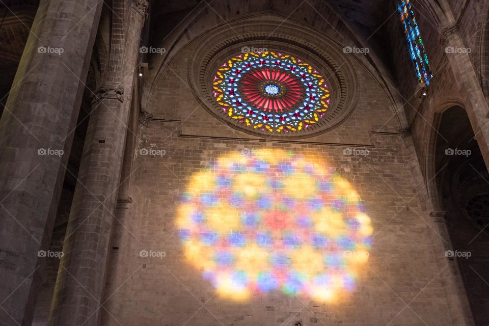 Rosette and rosette reflection at Palma (Mallorca, Spain). Light effect that appears twice a year in Palma Cathedral.