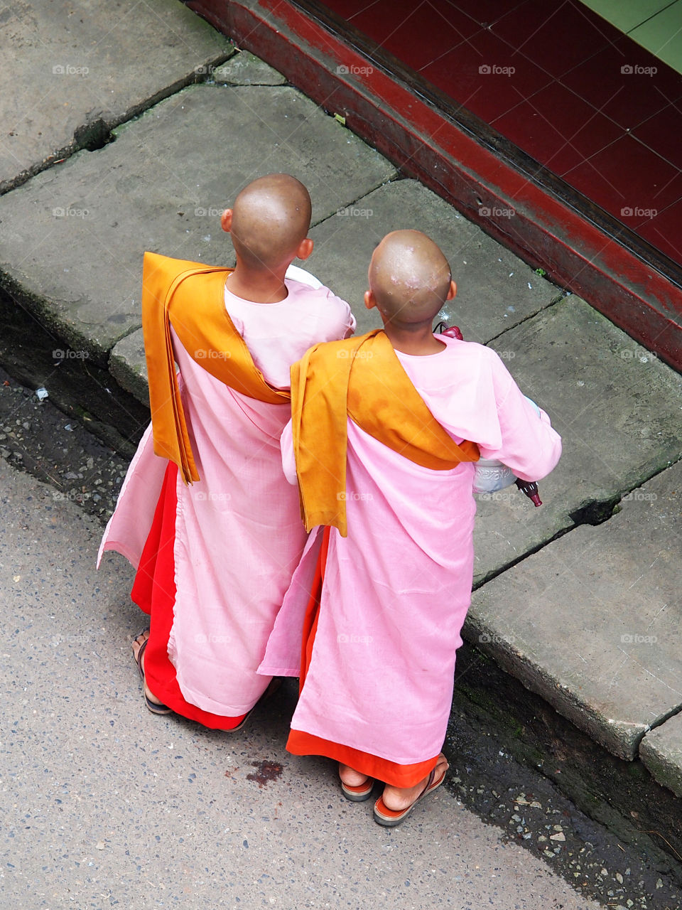 Burmese nuns in pink sarong