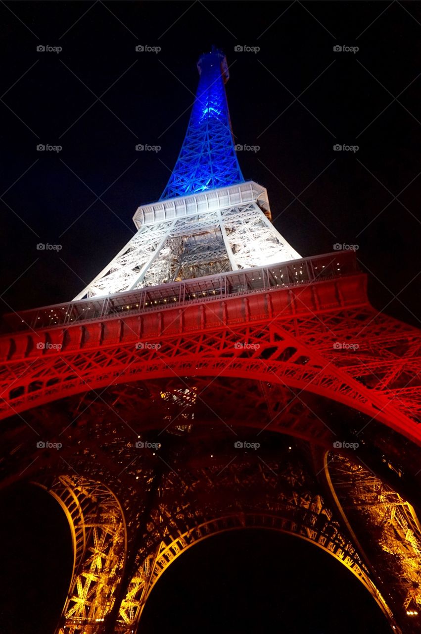 The Eiffel Tower lit up after the Paris attacks, Nov 2015