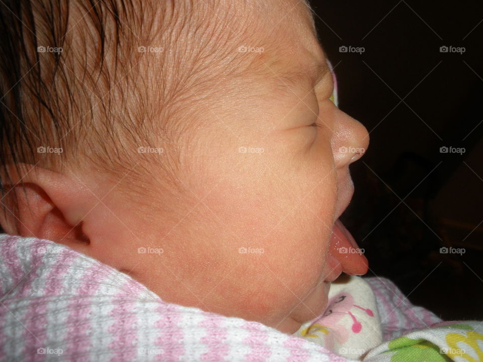 Blah!. Baby, in profile with tongue out