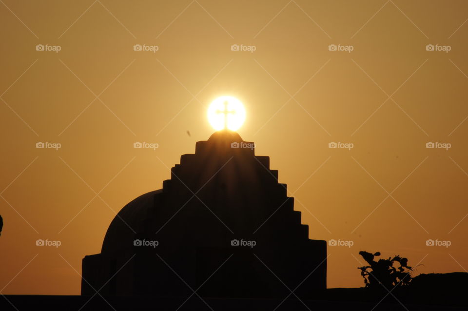 Silloette Sunrise - Sunrise coming up behind a chapel in Mykonos, Greece.