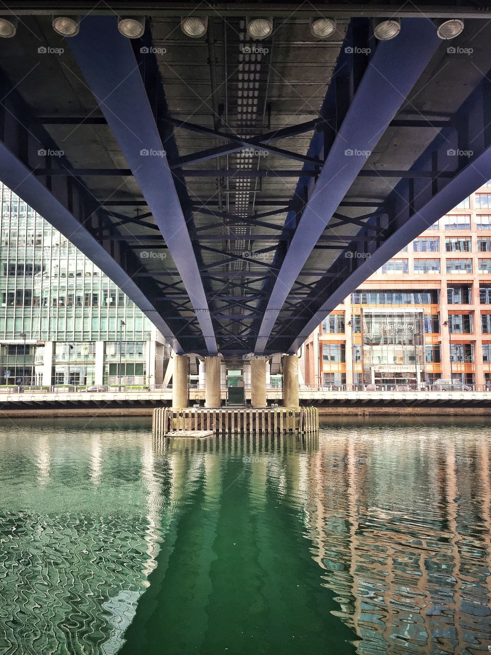 Walking under a bridge in Canary Wharf, London. Life here is so busy. Building bridges and not walls is what brings us together in a world of high speeds.