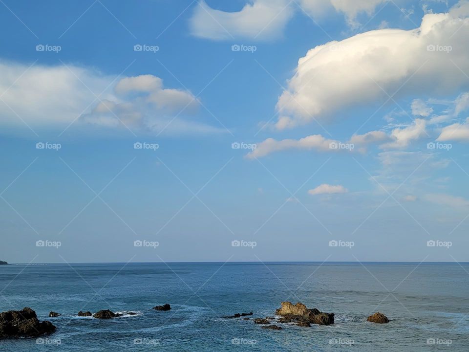 sky and sea and stone