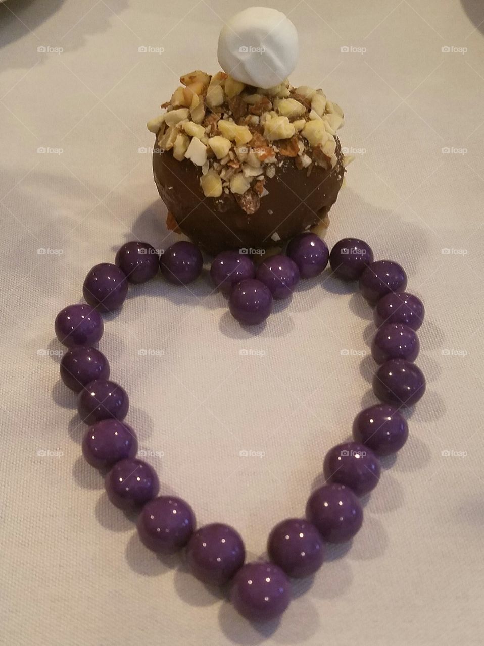 heart-shaped candy with chocolate covered strawberry