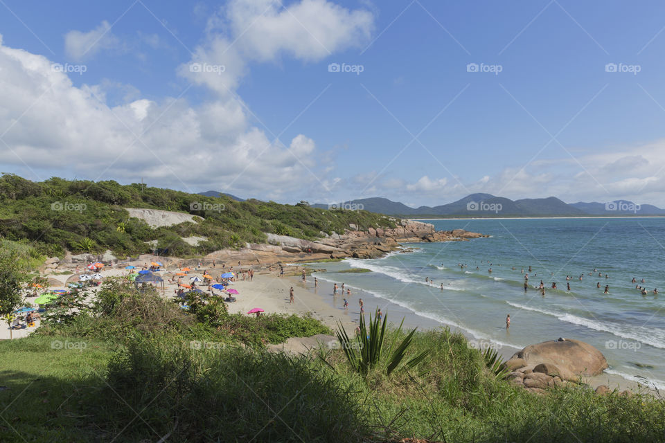 Tourists enjoy the summer on the little beach in Barra da Lagoa in Florianopolis Santa Catarina Brazil.