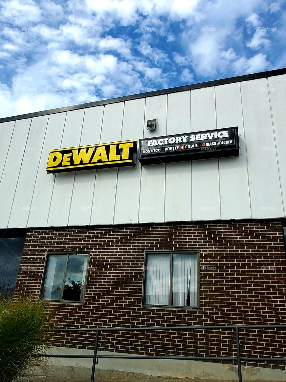 DeWALT TOOLS Factory Service, Parts store also sells Attachments. Roadside building seen from public parking lot. DeWALT sales & service.