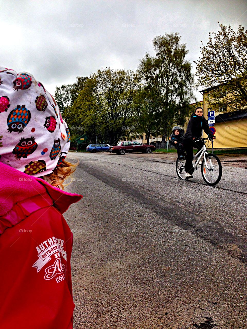 Woman riding bike with her baby