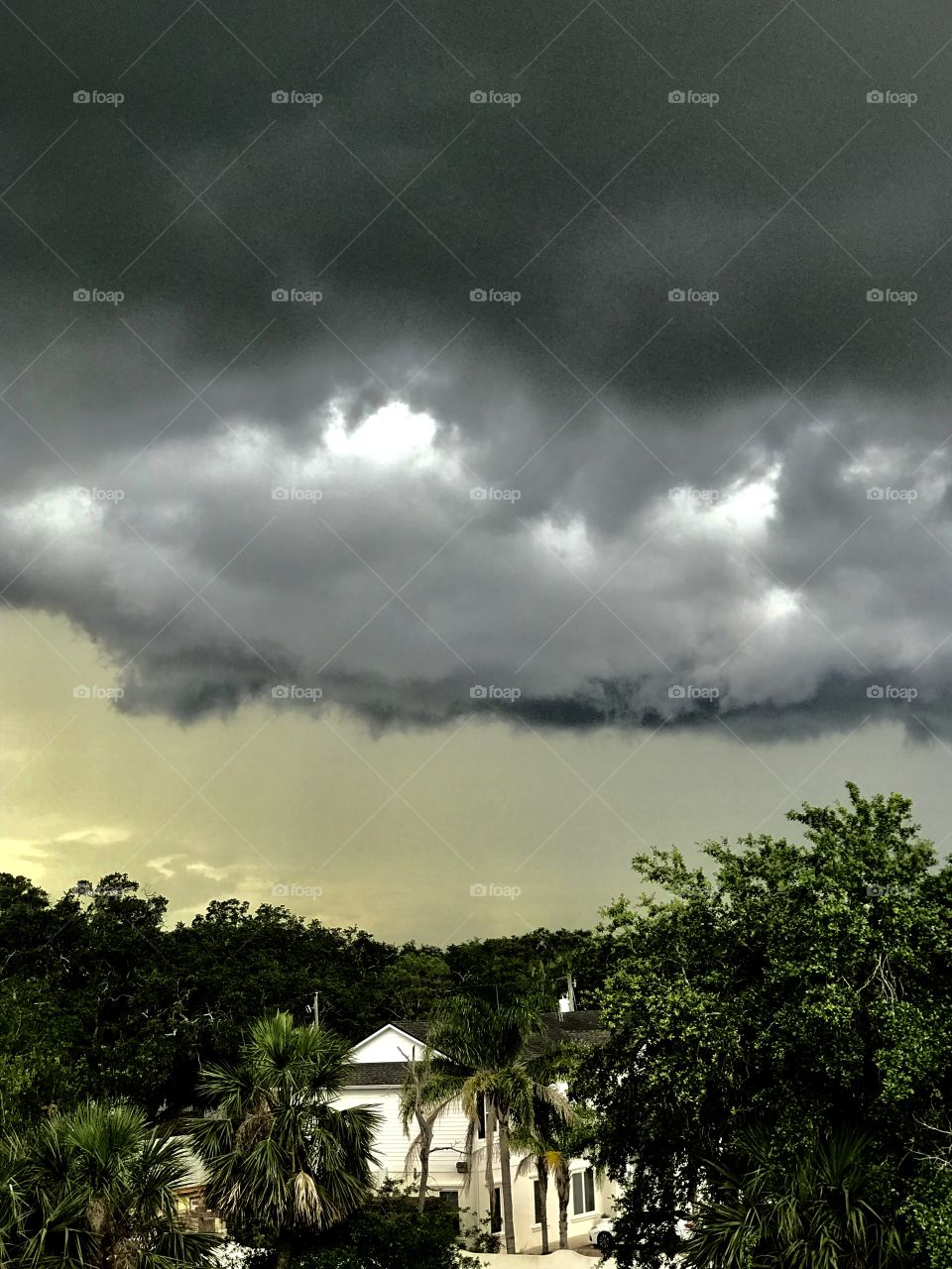 4th story window view of Dark black storm clouds front line over St. Augustine, Florida 