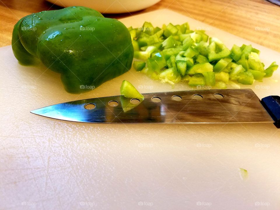 chopping green bell pepper