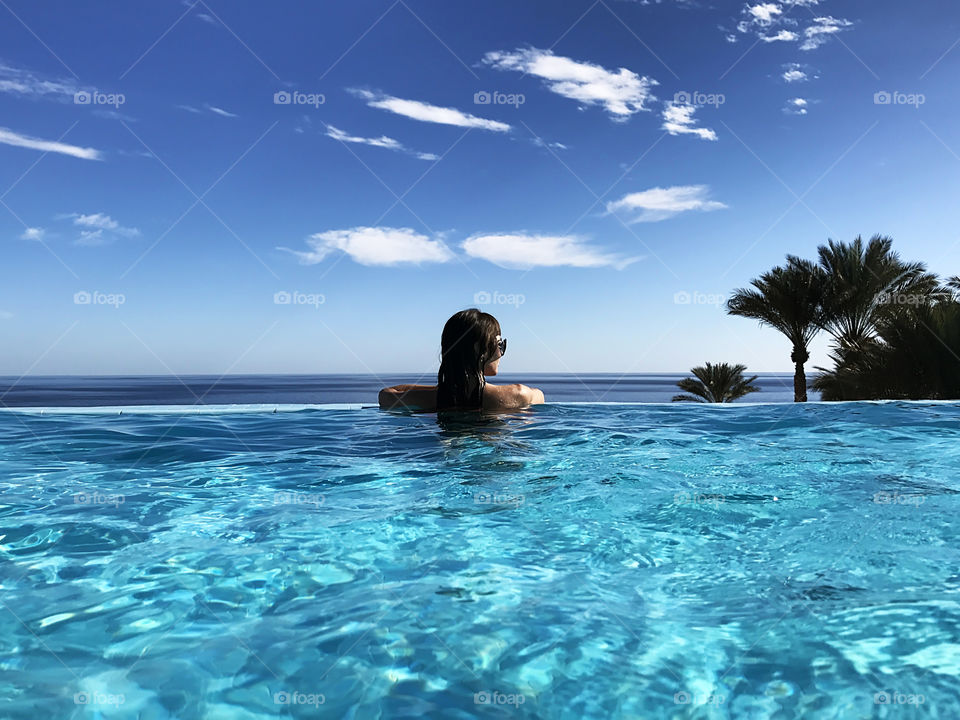 Luxury lifestyle at the swimming pool above the sea water