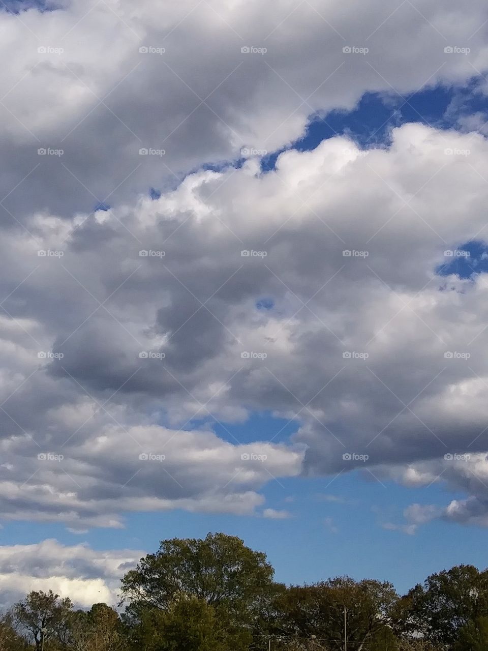 fluffy clouds in daytime