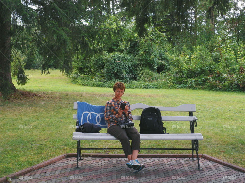 girl sitting on a bench in the park