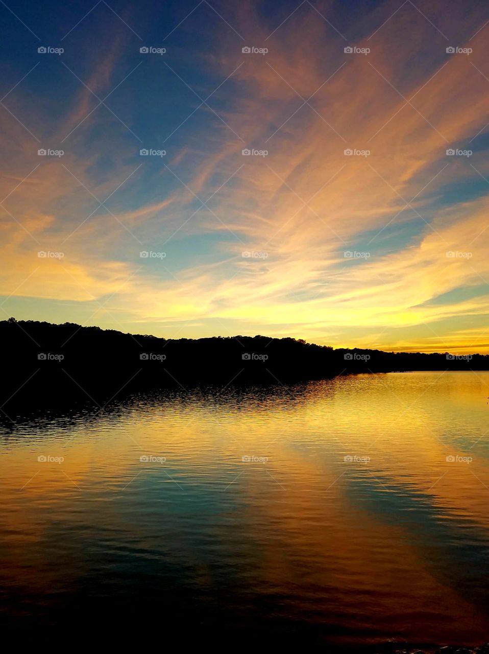 radial sunset over island