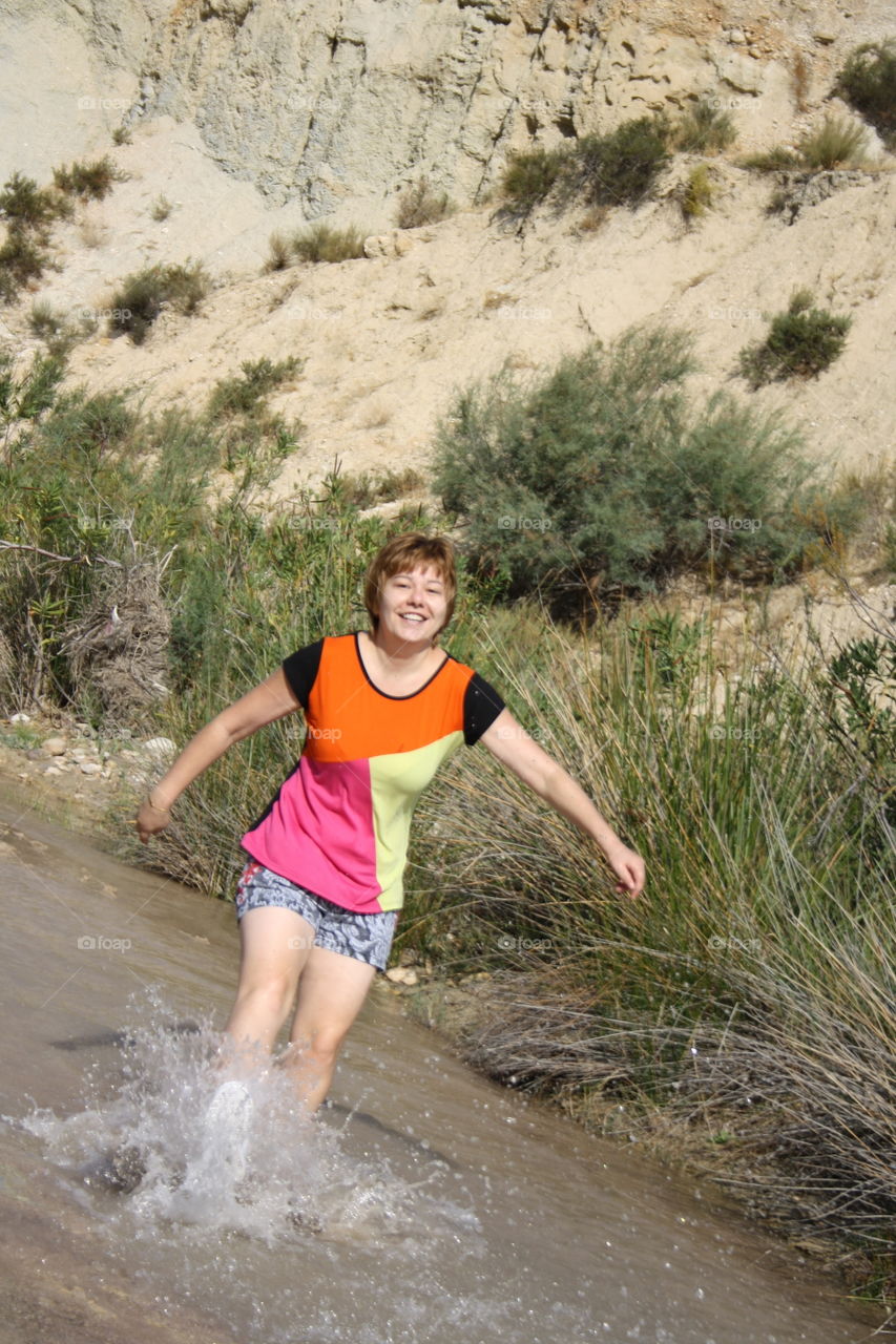 Splashing through the river.