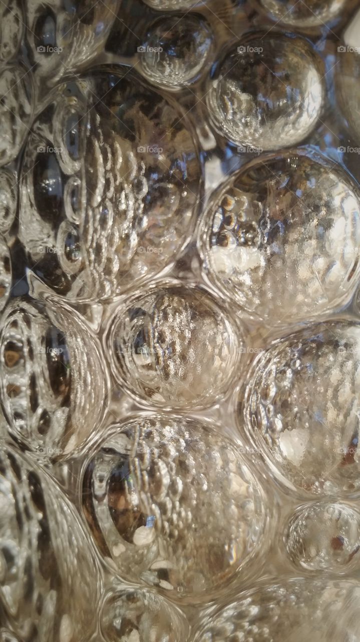 Bubbles on a glass wall.